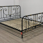 Brass-Accented Iron Art Bed